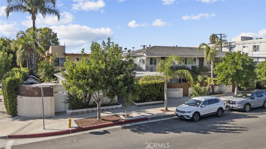 Exterior view of the apartment complex with parking area
